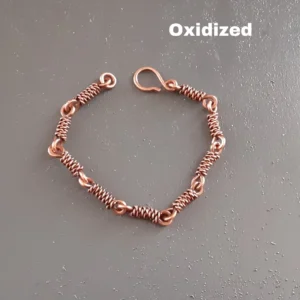 This handcrafted bracelet is made from solid copper wire, linked and tightly wrapped for a unique rustic look. 
